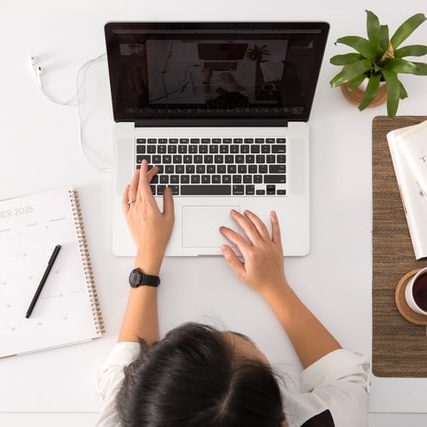 Person using laptop to expand their business.